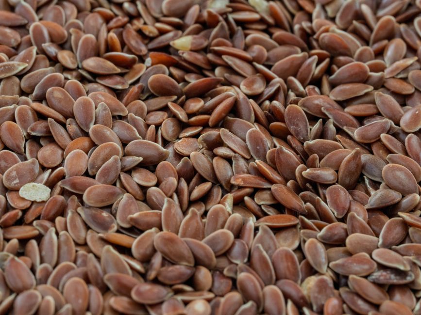 Macro shot of brown flax seeds highlighting their texture and natural health benefits.